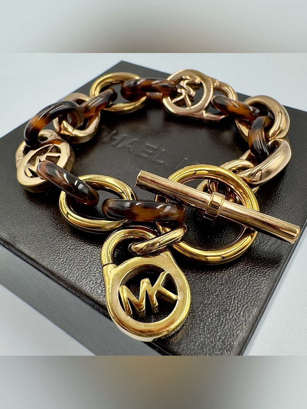 Michael Kors “Gold Tone Tortoise Link Bracelet” with Toggle Clasp
